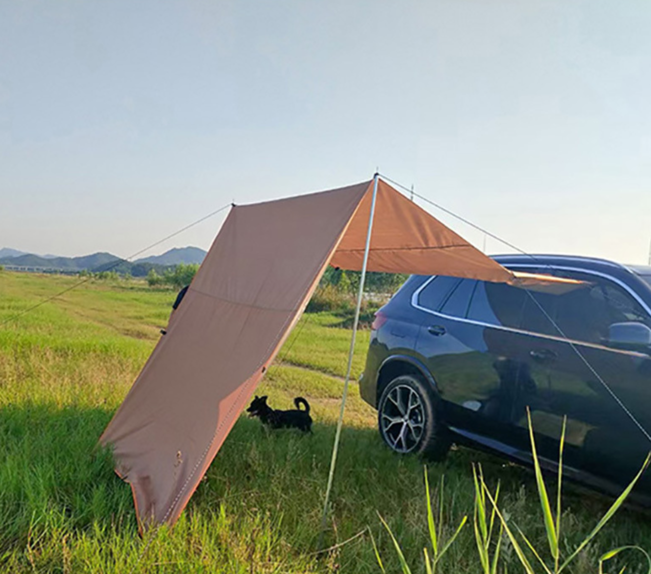 Silver-coated car awning tent for outdoor camping.